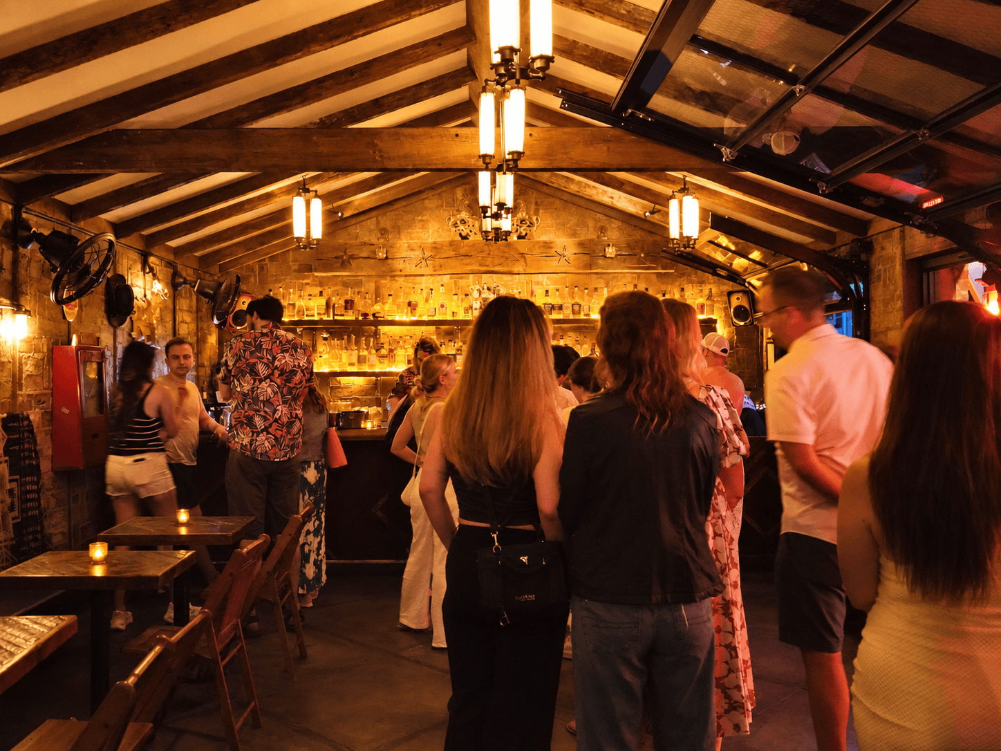 A lively crowd gathered inside a warmly lit Nashville bar